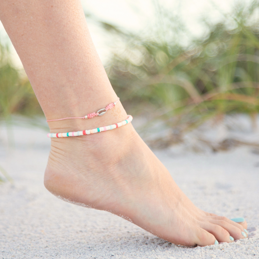 Silver Cowrie Puka Shell on Pink String Anklet on White